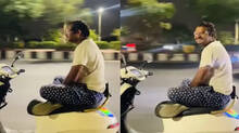man-rides-scooter-hands-free-cross-legged-video-goes-viral-outrage